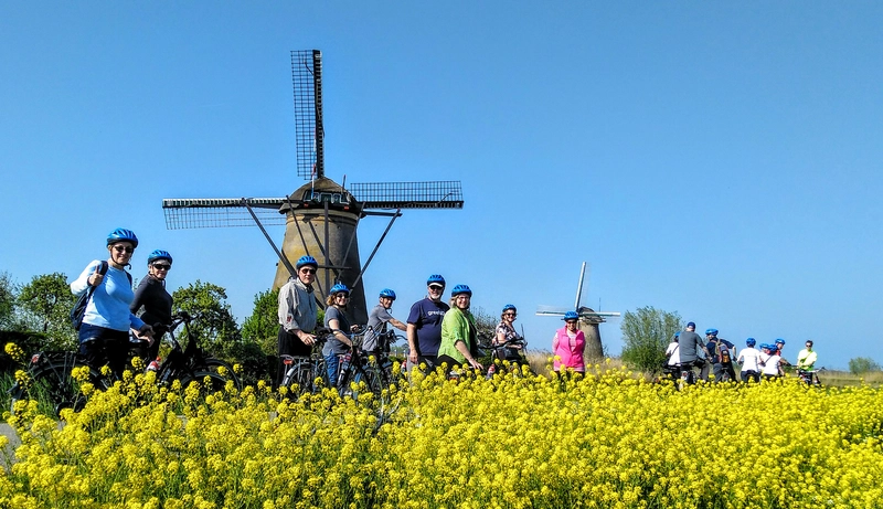 Guests enjoy their bike tour past the windmills of Kinderdijk